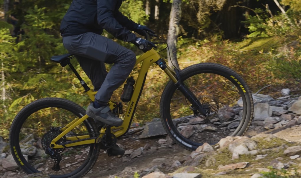 Guy riding trek bike on a steep uphill 