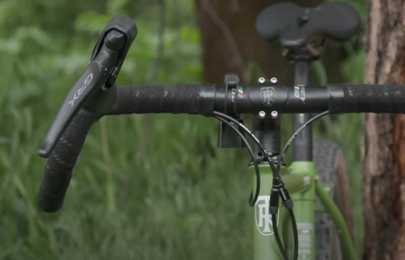 A bicycle with a black handlebar