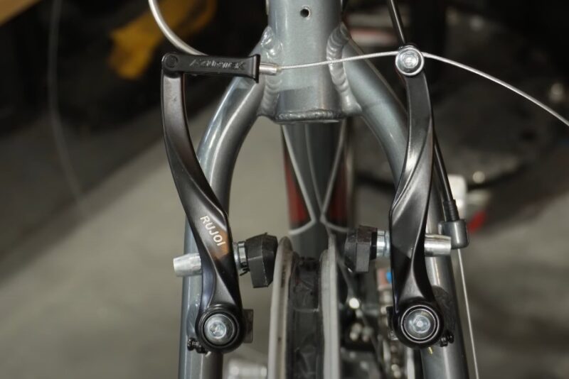 Close up photo of V-brakes on a bike