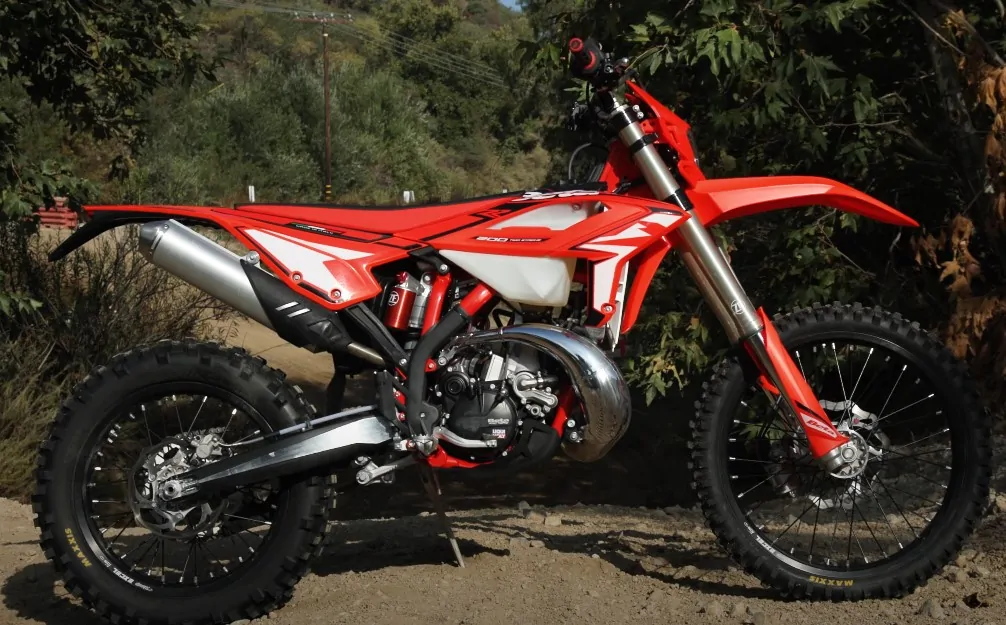 Red 200cc dirt bike parked