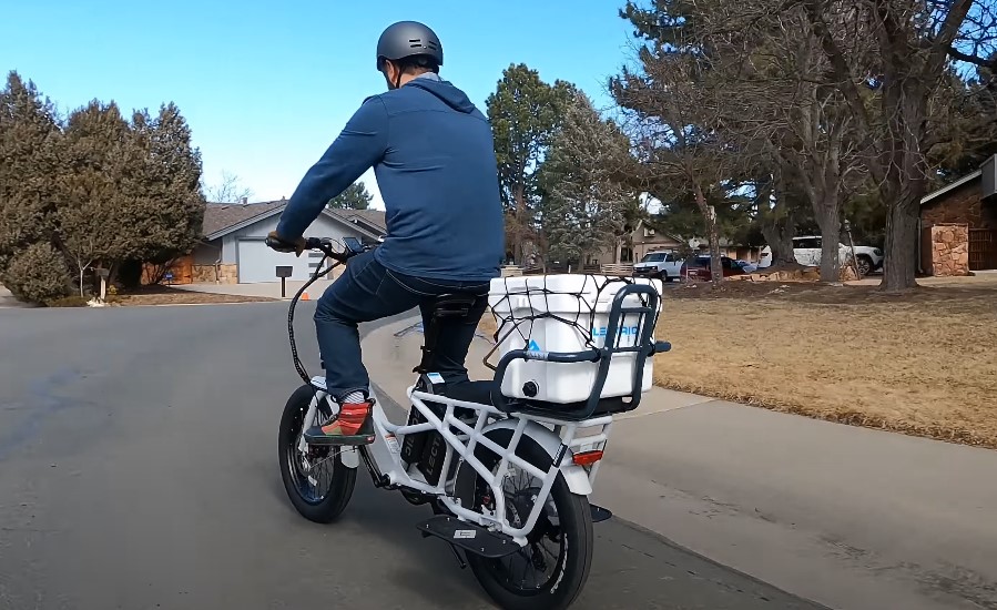 A delivery guy rides an e-bike