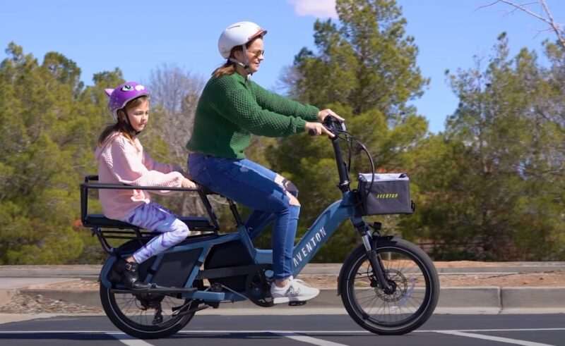 Mom and daughter riding on e-bike