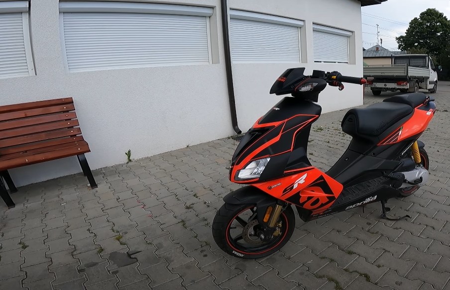 Black and red Aprilia SR 50