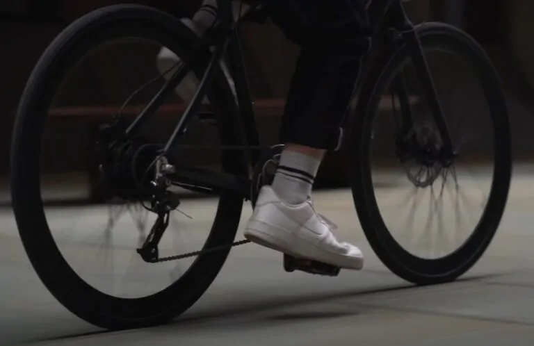 Close up photo of a man riding e bike