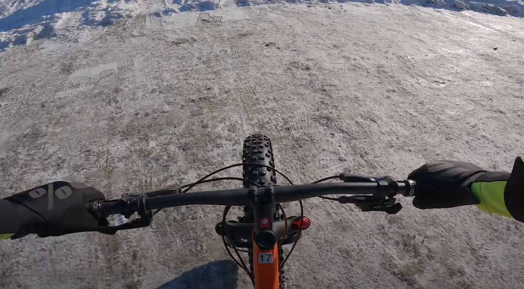 A photo from a first-person perspective of a person riding fat bike