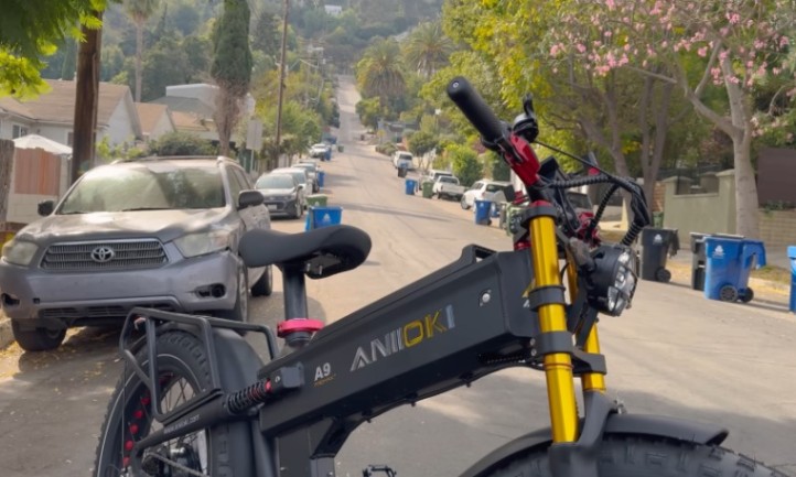 An electric bike parked on the side of a road